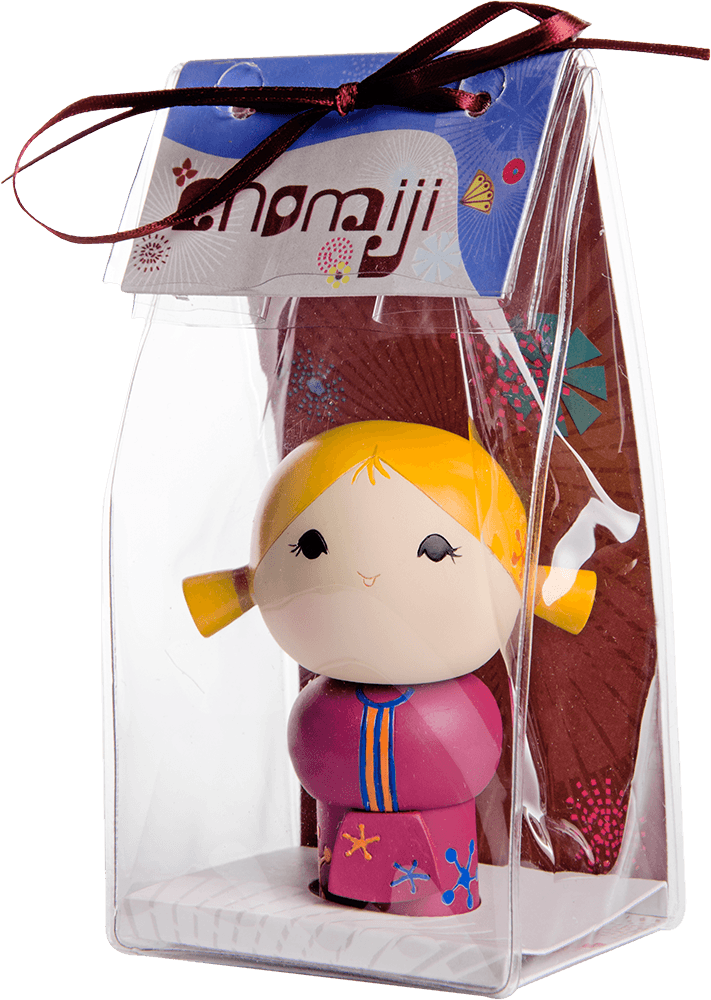 Chatting Momiji doll with yellow pigtails, pink outfit, displayed in a clear box with a ribbon; collectible message inside. — Momiji Doll