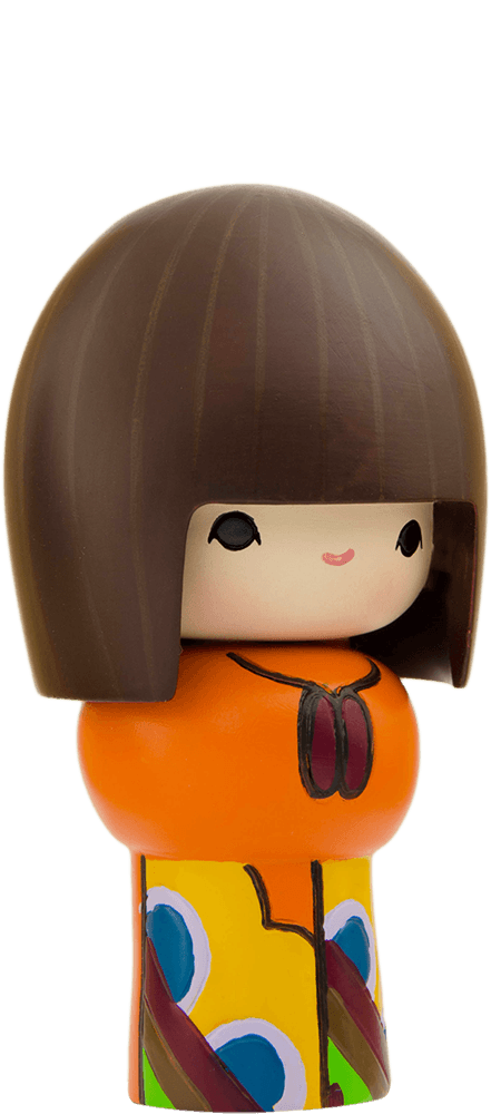 Rainbows is a Momiji doll with a brown bob, gentle smile, orange top, and a vibrant, multicolored skirt. — Momiji Doll