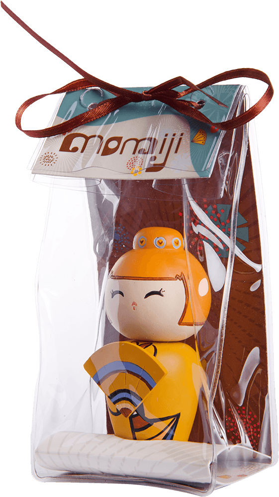 Lovely Day Momiji doll in an orange dress holding a fan, packaged in a clear bag tied with ribbon and a tag. — Momiji Doll