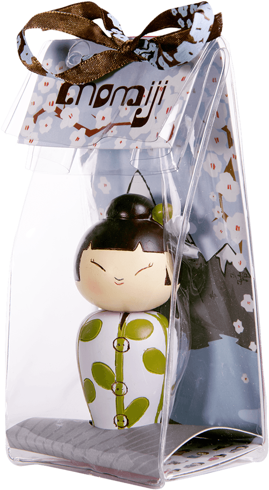 Higgledy-piggledy Momiji doll with green polka dots in clear packaging, brown ribbon, and floral details. — Momiji Doll