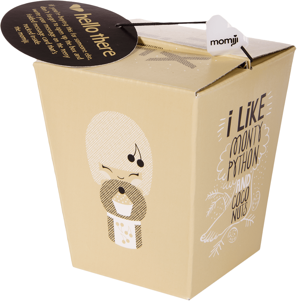 Tan takeout box with Pixie Momiji doll, kawaii design, "I like Monty Python and coconut." Black tag: hello there. — Momiji Doll