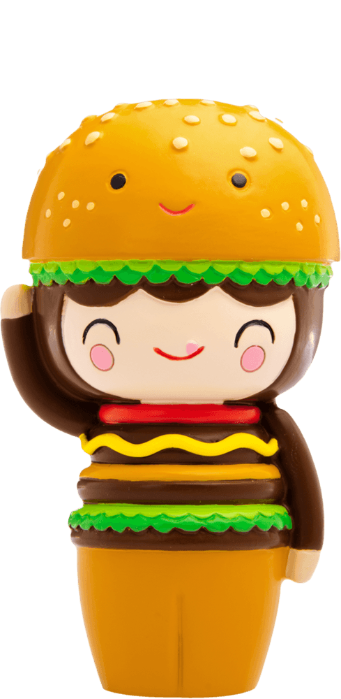 Giggles Momiji doll sports a hamburger bun hat, lettuce hair, burger outfit, and waves with a huge smile. — Momiji Doll