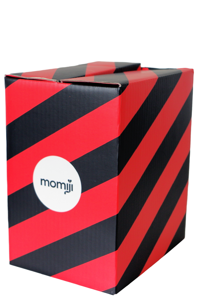 Scarlett Momiji doll comes in a 12cm black box with diagonal red stripes and a white circular Momiji dolls logo on the side. — Momiji Doll