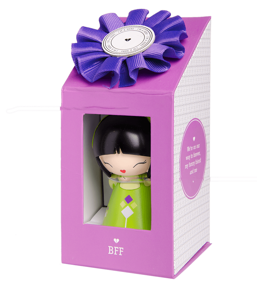 A Momiji doll named BFF wears a green dress, sitting in a purple gift box with a blue ribbon, kawaii and collectible. — Momiji Doll