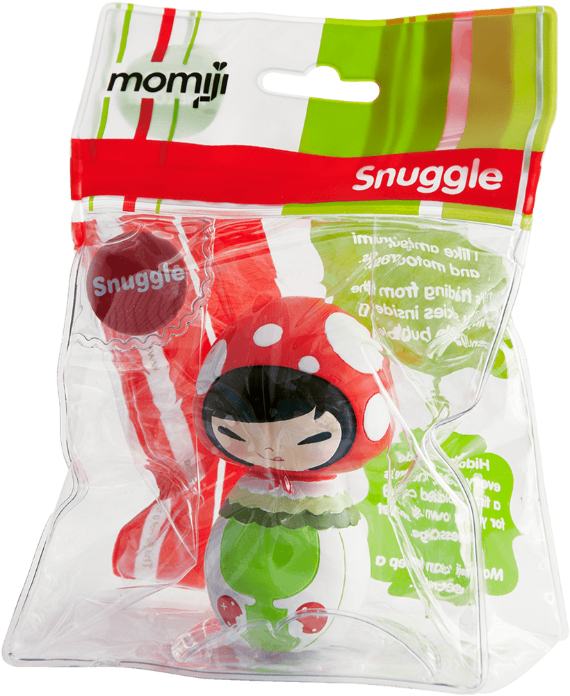 A gift-ready Snuggle Momiji doll in clear packaging, showing the red and green character with kawaii details inside. — Momiji Doll