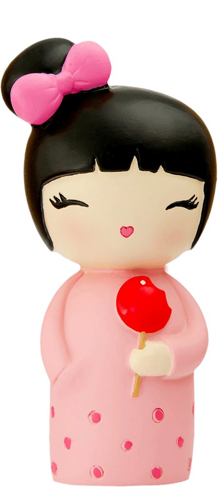 Birthday Girl Momiji doll with black hair, pink dress and bow, holding a red lollipop, smiling with closed eyes. — Momiji Doll