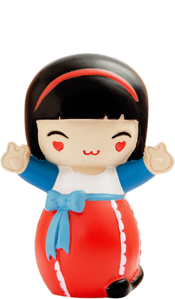 Lucky Momiji doll with black hair, red headband, heart cheeks, blue top, red skirt, and hands showing a peace sign. — Momiji Doll