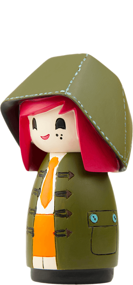 Mabel Momiji doll with red hair, green hooded coat, yellow tie, orange skirt, smiling with closed eyes. — Momiji Doll