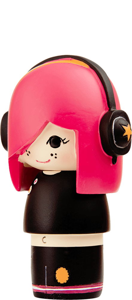 Momiji doll "Luca" with pink hair, black headphones, black outfit, and a small smile on a beige background. — Momiji Doll