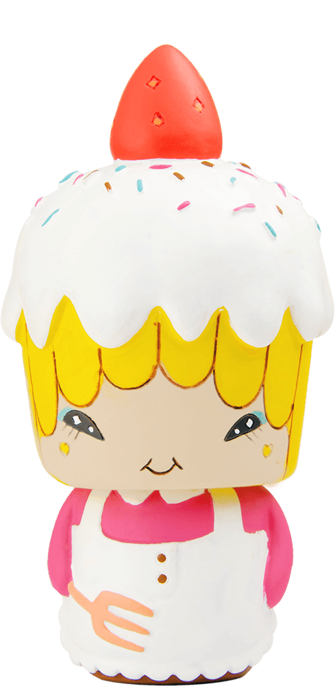 Bakey-C Momiji doll with yellow hair, pink dress, white apron, icing-shaped hat, and a red strawberry on top. — Momiji Doll