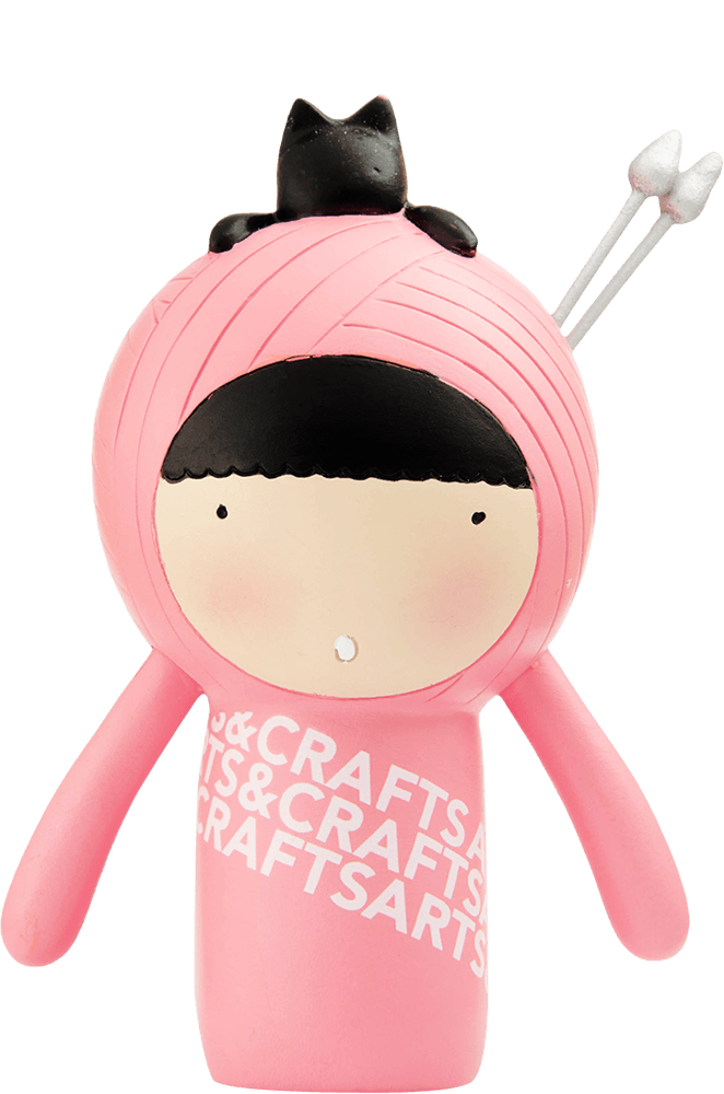 Purrl Momiji doll is pink with a black bun, silver knitting needles, and "CRAFTS" on her outfit. Secret message inside. — Momiji Doll