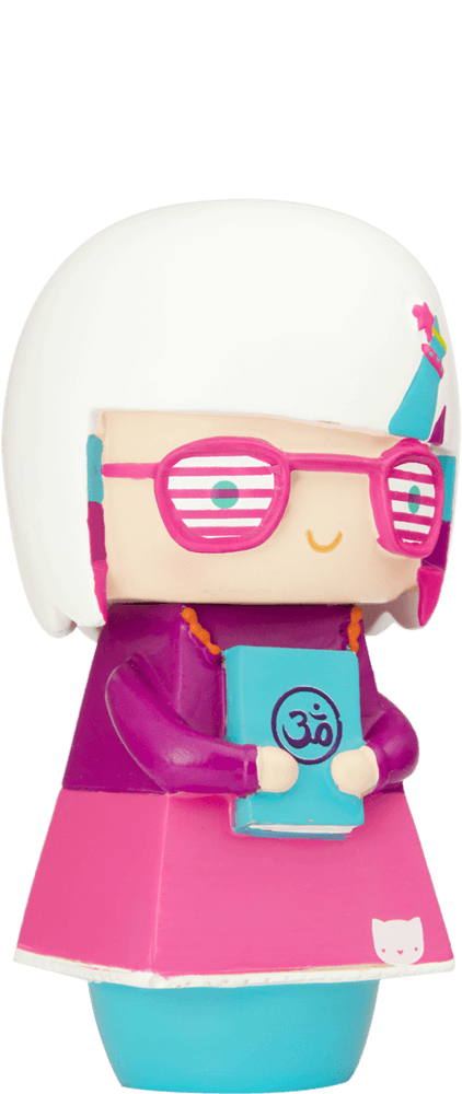 Enid Momiji doll with white hair, pink glasses, holding a blue Om book and wearing a bright pink dress. — Momiji Doll