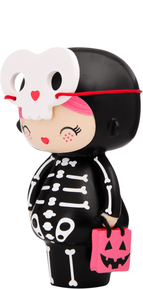 Spookie Momiji doll in a skeleton costume, pink pumpkin bag, and white skull mask resting on its head. Kawaii style. — Momiji Doll