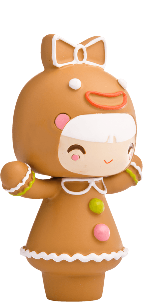 Treacle Momiji doll is dressed as a gingerbread person with white icing details and bright, colorful buttons on her outfit. — Momiji Doll