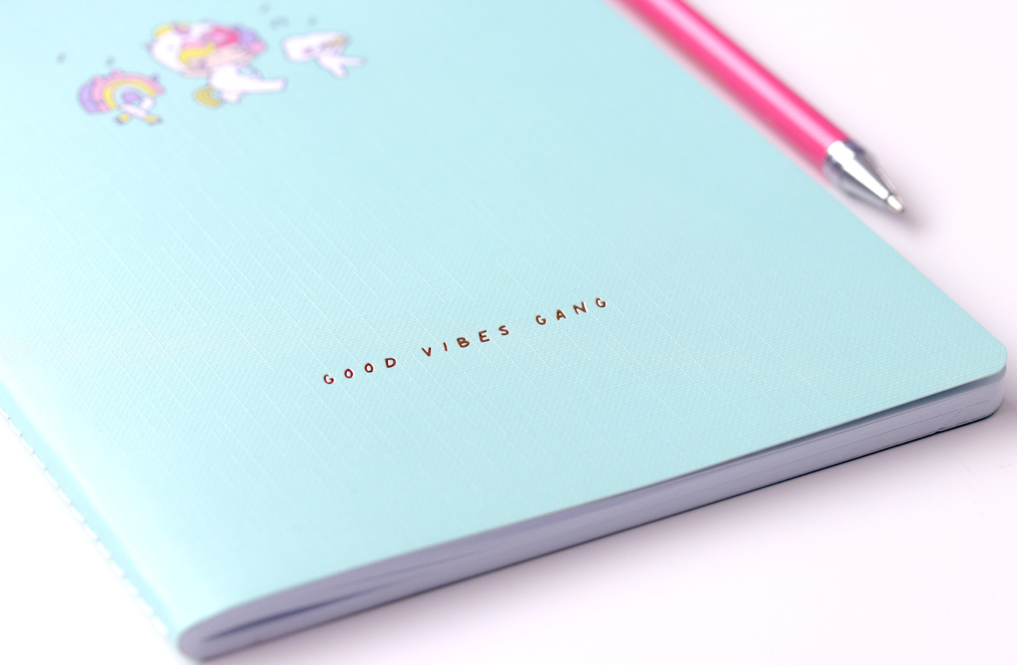Good Vibes Gang Momiji doll-themed notebook, light blue A5, cute stickers, and pink pen on a white surface. — Momiji Doll