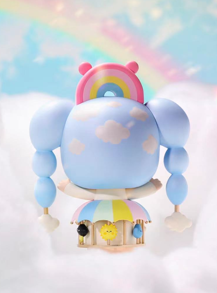 Sky Dreamer Momiji doll is a pastel blue collectible cloud with a rainbow, floating above a whimsical weather carousel. — Momiji Doll