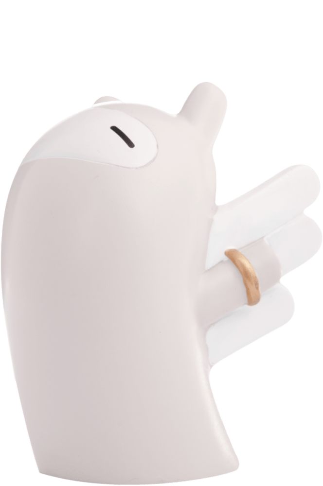 Bravery Momiji doll: minimalist white vinyl figure, closed eyes, hand raised with a gold ring, cute and collectible. — Momiji Doll