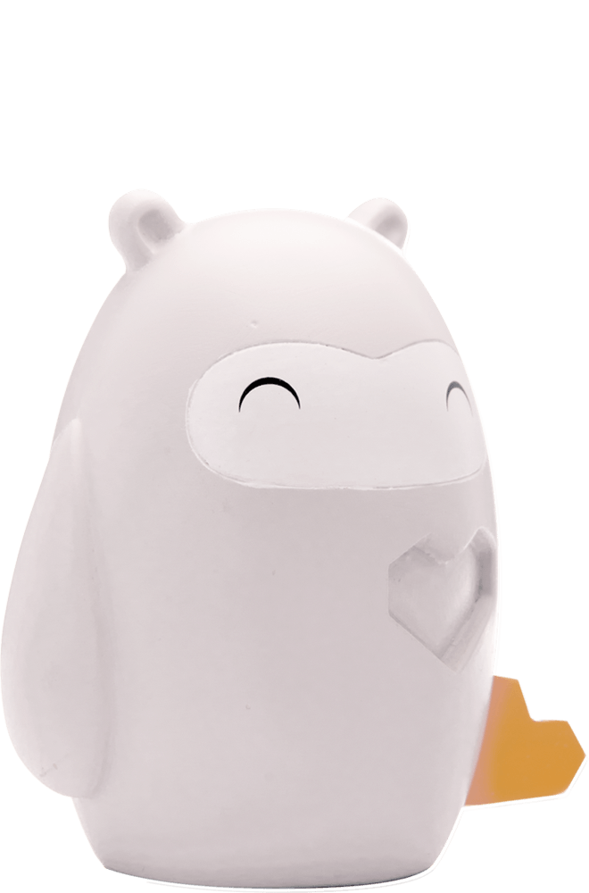 Kindness Momiji doll: white, round, owl-like with a smiling face, small ears, and a yellow heart on its side. — Momiji Doll
