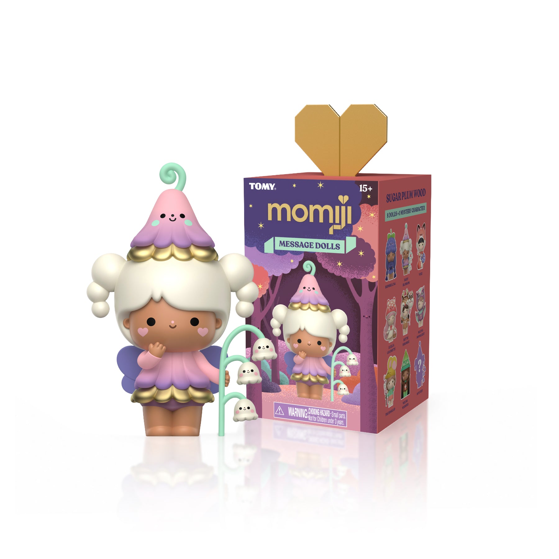 Momiji doll in pastel colors with a ghost hat stands by Sugar Plum Wood Momiji Dolls box topped with gold heart-shaped lid. — Momiji Doll