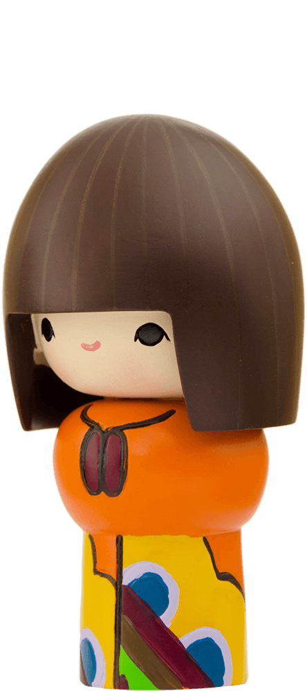 Rainbows Momiji doll with a round face, straight brown hair, and an orange-yellow patterned outfit. — Momiji Doll