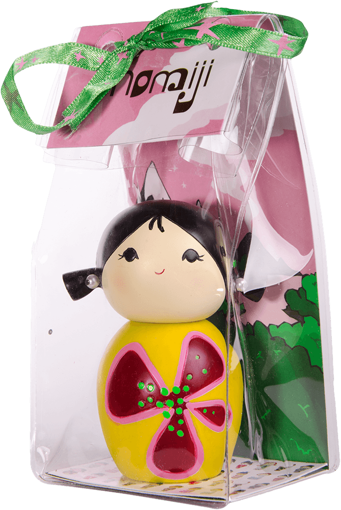Dreaming Momiji doll with black hair, yellow dress, pink flower, in a clear box tied with green ribbon. — Momiji Doll