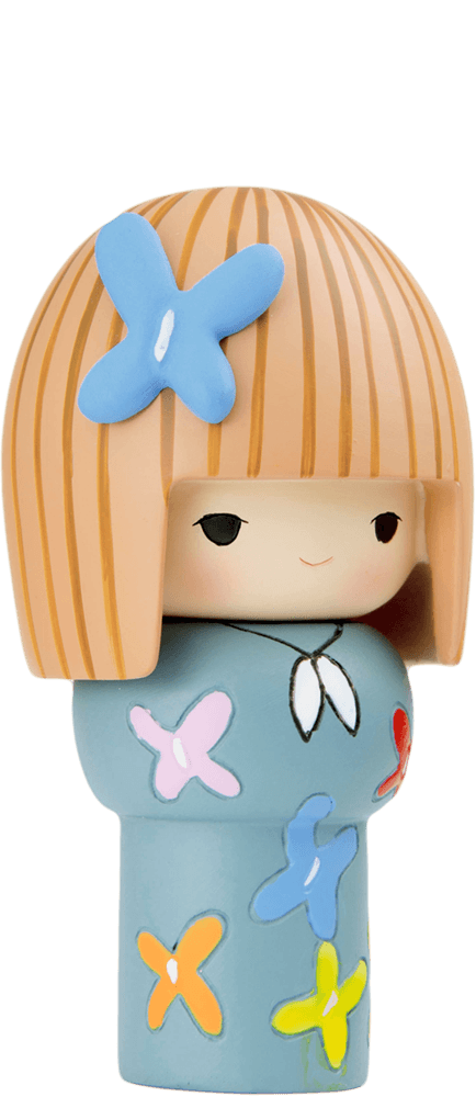 Honey is a Momiji doll with straight blonde hair, a blue butterfly hair clip, and an outfit decorated with blue butterflies. — Momiji Doll