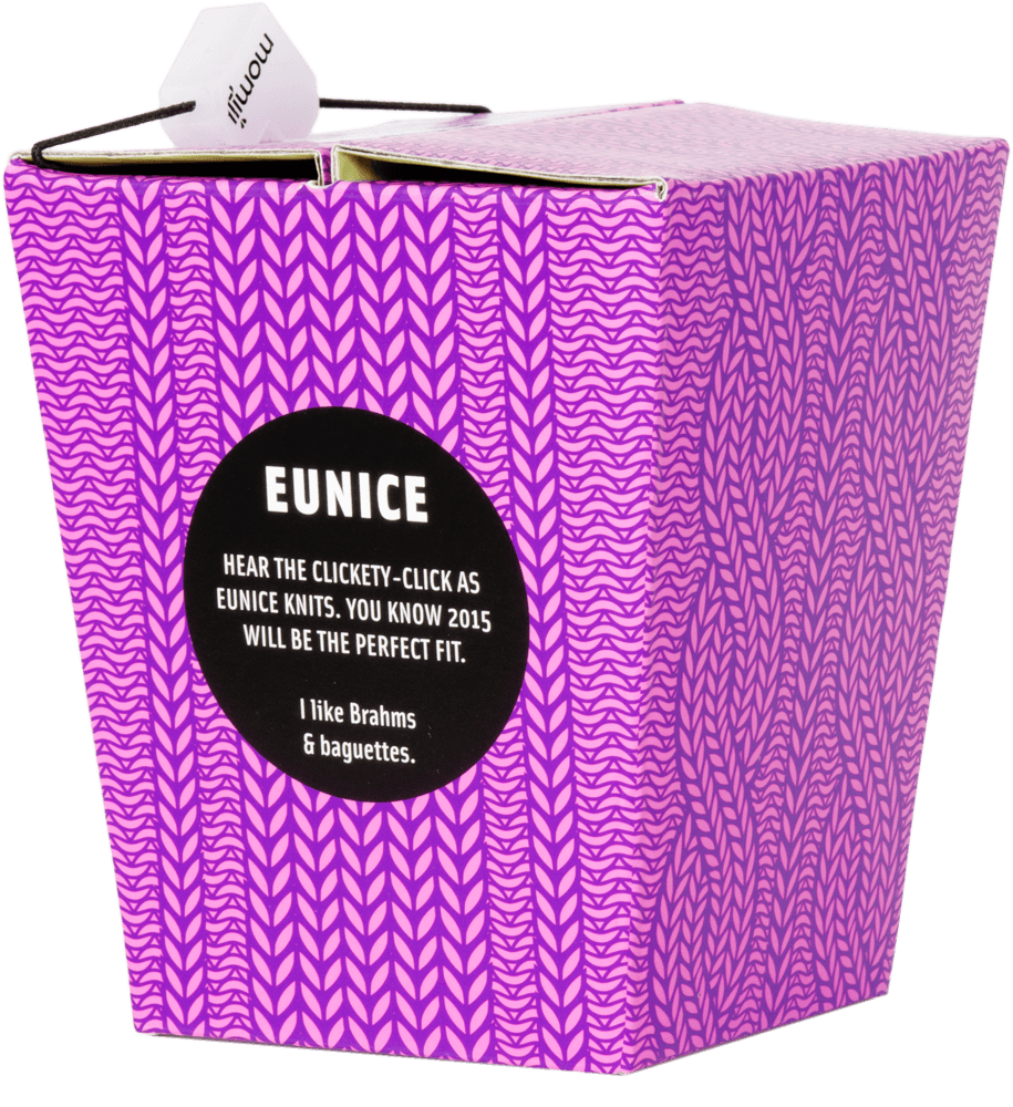 Eunice Momiji doll as a kawaii purple patterned takeout box, featuring a playful knitting-themed gift message on the front. — Momiji Doll