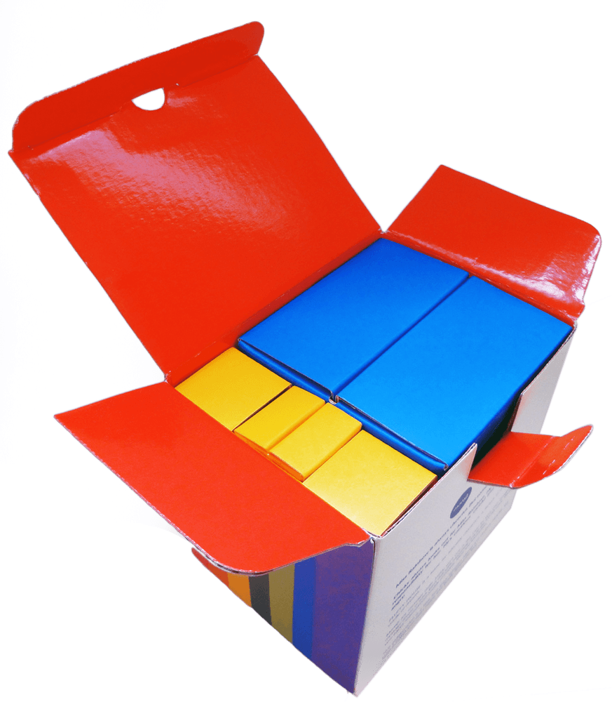 Open box with Miss Rainbow and Chicky Momiji dolls, colorful and neatly packed inside, on a white background. — Momiji Doll