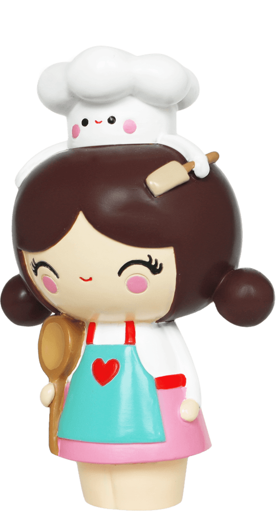 Cupcake HN Momiji doll with brown hair, chef hat, white apron, and pink cheeks. Includes a secret message slot. Collectible and cute. — Momiji Doll