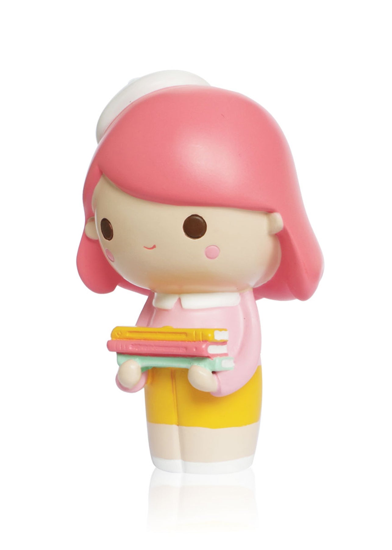 Curiosity Momiji doll with pink hair, yellow skirt, and white hat holding colorful books on a plain white background. — Momiji Doll