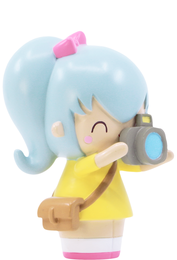 Pixie Pixel Momiji doll with blue hair, yellow dress, pink bow, brown bag, and camera—kawaii collectible by indie artists. — Momiji Doll