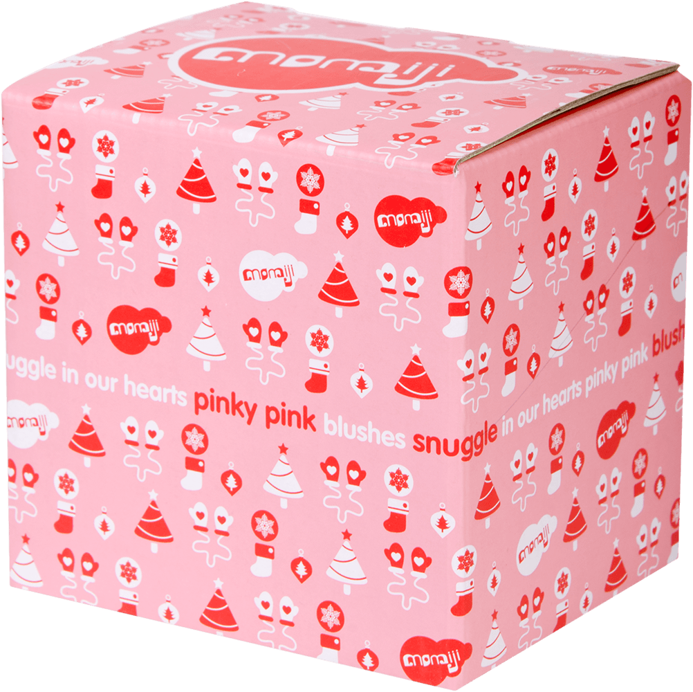 Pink box with festive patterns, a kawaii Momiji doll graphic, and text: Snuggle In Our Hearts Blushes. — Momiji Doll