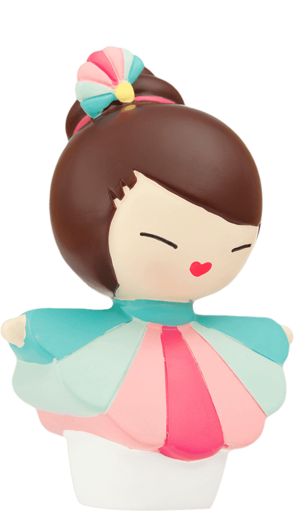 Hero Momiji doll with brown hair in a bun, colorful dress, and a cheerful smile. Cute collectible with secret message inside. — Momiji Doll