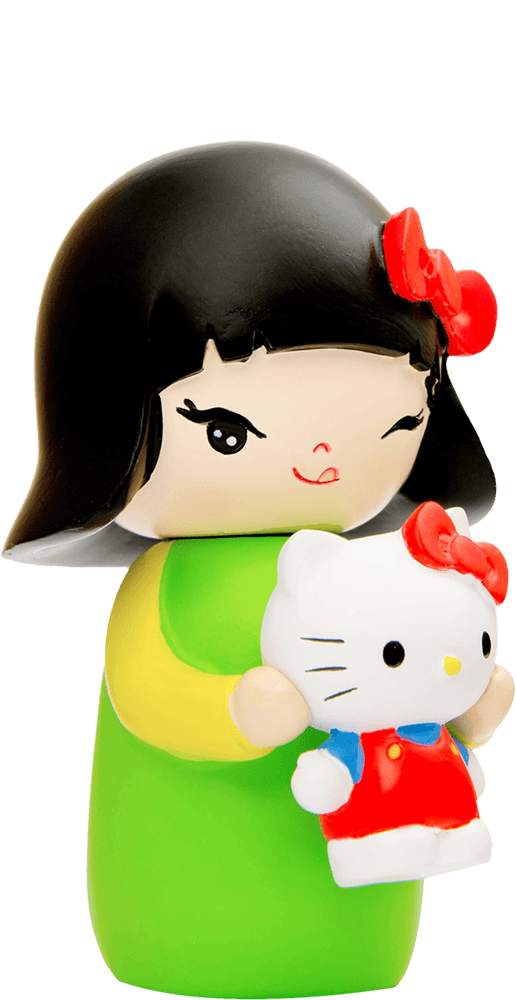 Aya Momiji doll with black hair and a red bow, holding a colorful smiling Hello Kitty toy. Kawaii collectible character. — Momiji Doll