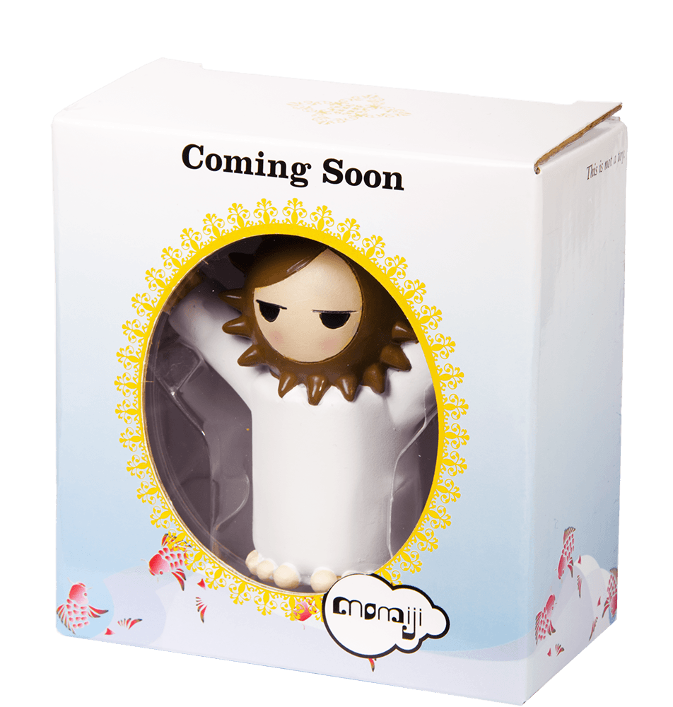 Momiji doll "Coming Soon" with a fluffy lion mane, in a box with a circular window and decorative border. — Momiji Doll