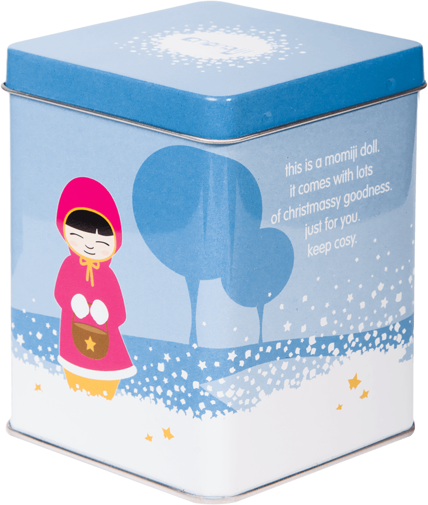 Twinkle Momiji doll tin shows a blue and white winter scene with Twinkle in a red hood and festive message along the side. — Momiji Doll