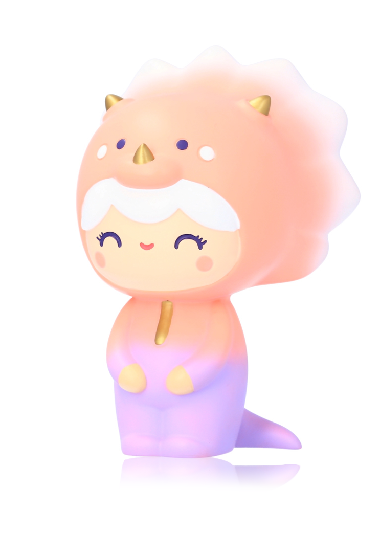 A Roarsome Momiji doll, 5.5", in a pink and purple tricera-TOPS costume, smiling with closed eyes on a white background. — Momiji Doll