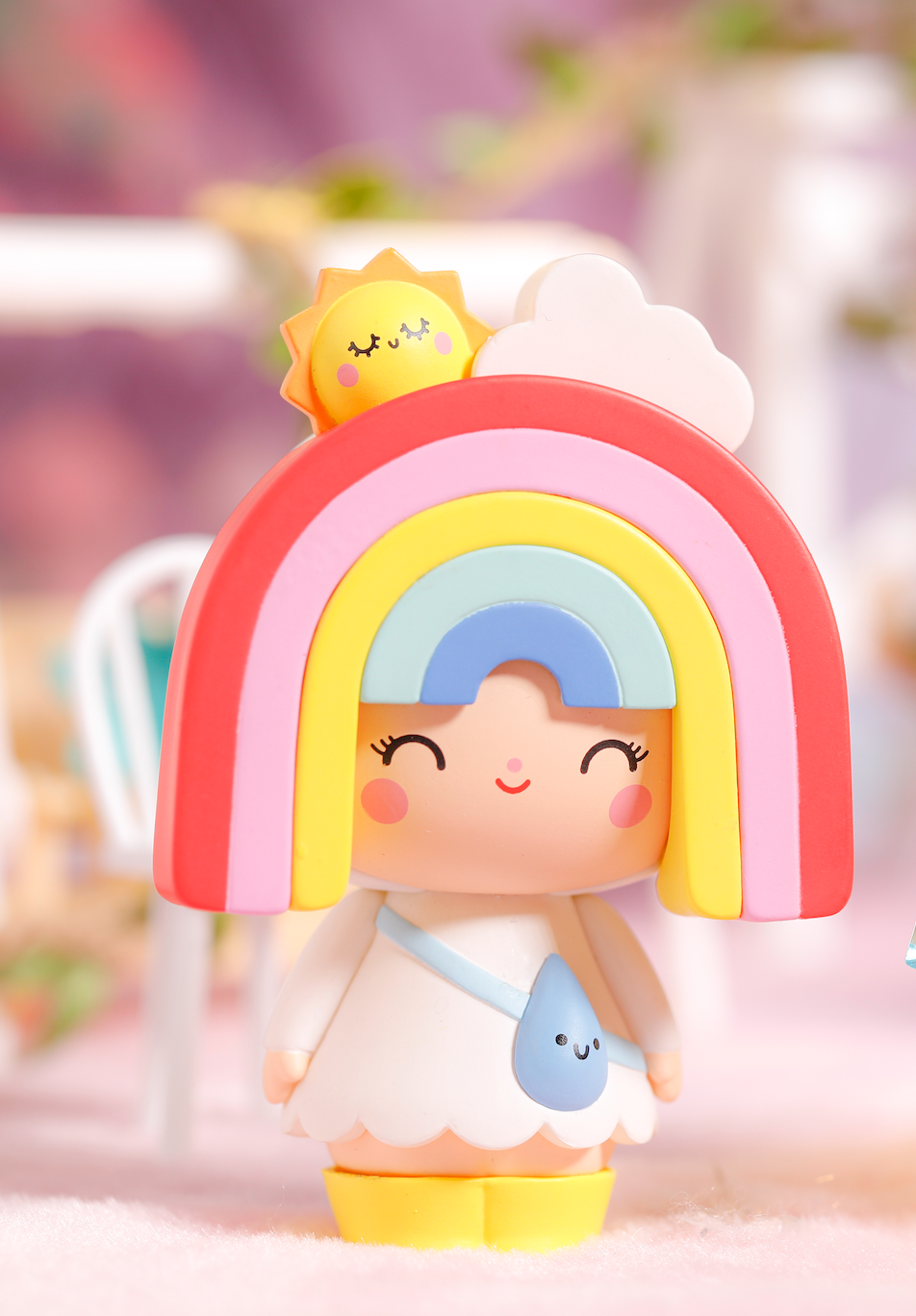 Momiji doll Skye with rainbow hair, a smiling face, and a tiny sun and cloud on her head. Collectible kawaii vinyl doll. — Momiji Doll