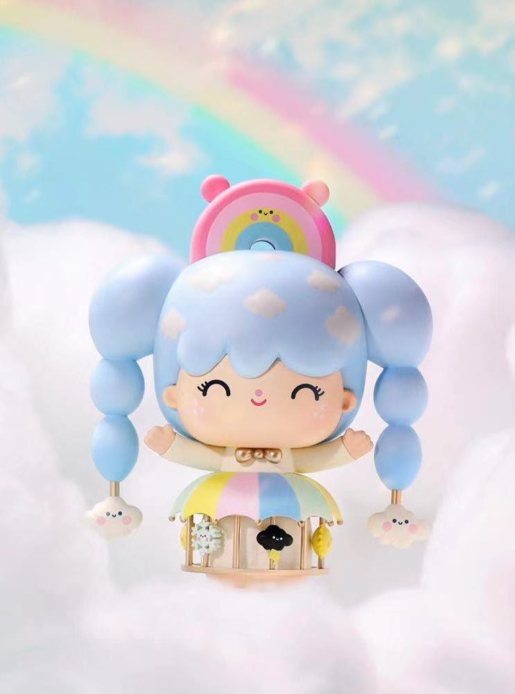 Sky Dreamer Momiji doll with blue pigtails floats among pastel clouds and a rainbow in the Weather Carousel series. — Momiji Doll