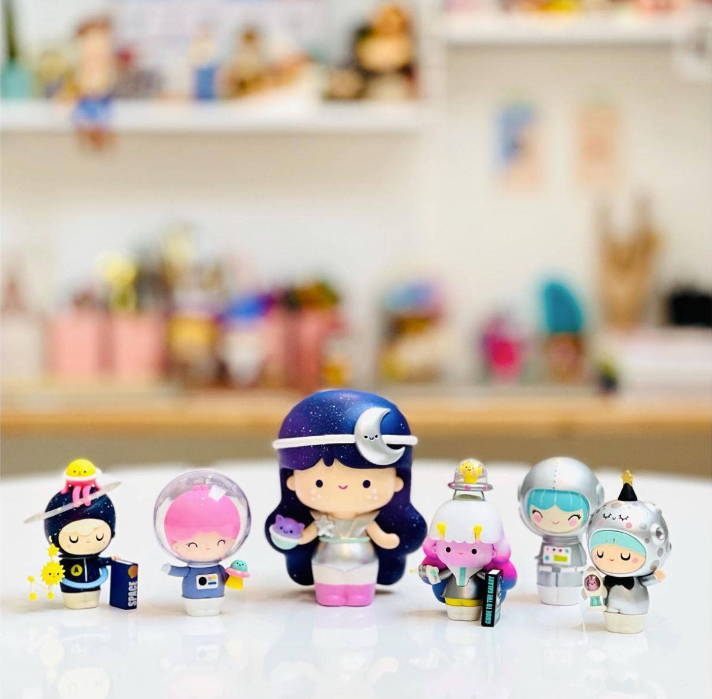 The Electra Momiji doll, 5.5" tall with a space-themed outfit and cute face, is on display—limited stocks available. — Momiji Doll
